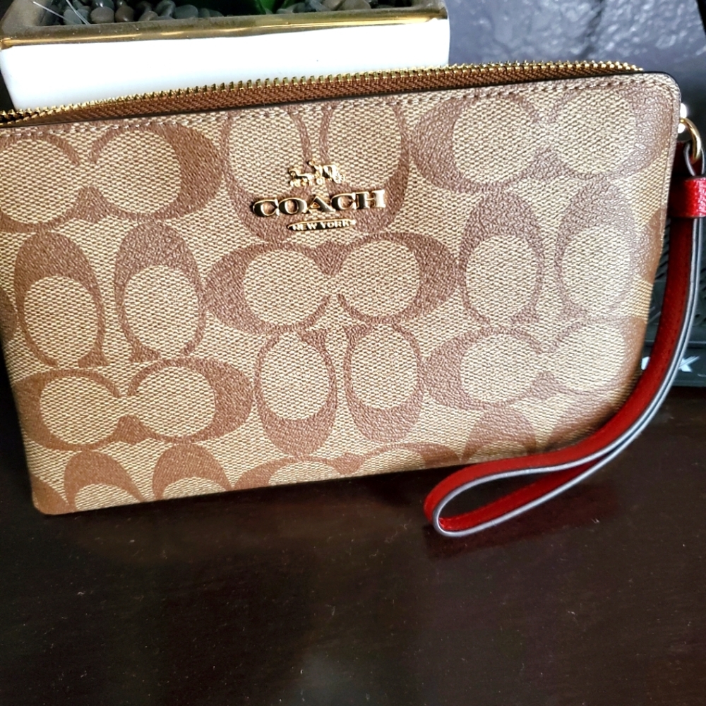 Coach Clutch wristlet handbag, brown with red strap, comes in box